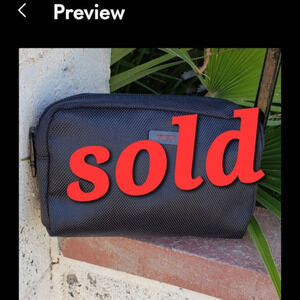 THE  TUMI‎ TRAVELING BAG